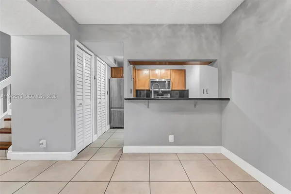 a view of a kitchen with a sink