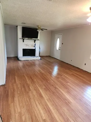 a view of a livingroom with furniture and a flat screen tv