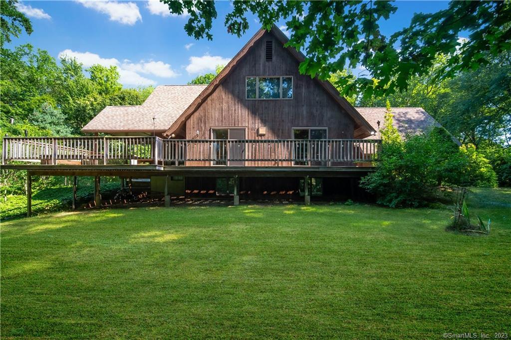 162 Lake Ridge Heights Middletown, CT 06457 - Photo 1 of 1 a front view of a house with yard and green space