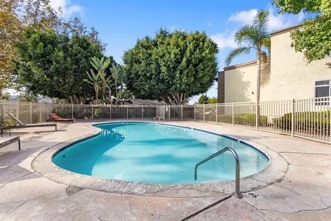 a view of a swimming pool with a patio