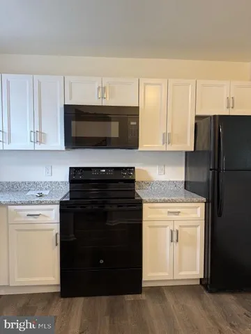 a kitchen with a stove and a microwave