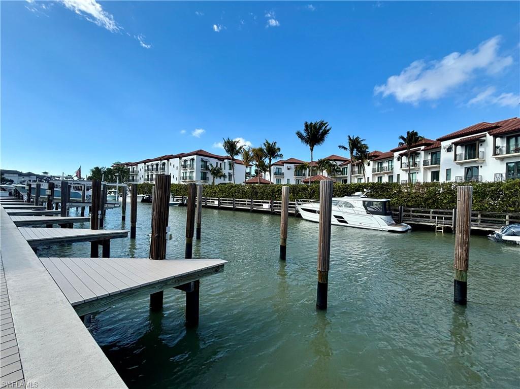 1435 Curlew Avenue, Unit 1 Naples, FL 34102 - Photo 15 of 19 a view of a lake from a balcony