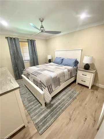 a bathroom with a granite countertop sink mirror vanity and toilet