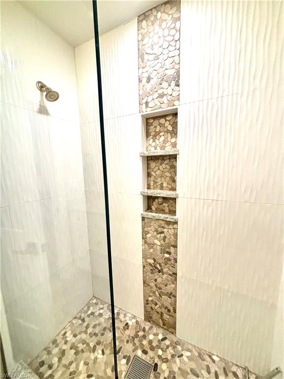 1435 Curlew Avenue, Unit 1 Naples, FL 34102 - Photo 6 of 19 a bathroom with a shower