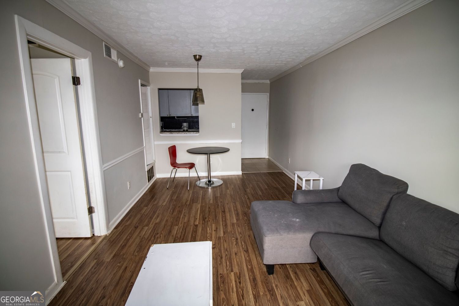 2805 Northeast Expressway Northeast, Unit C11 Atlanta, GA 30329 - Photo 6 of 14 a living room with furniture and a wooden floor