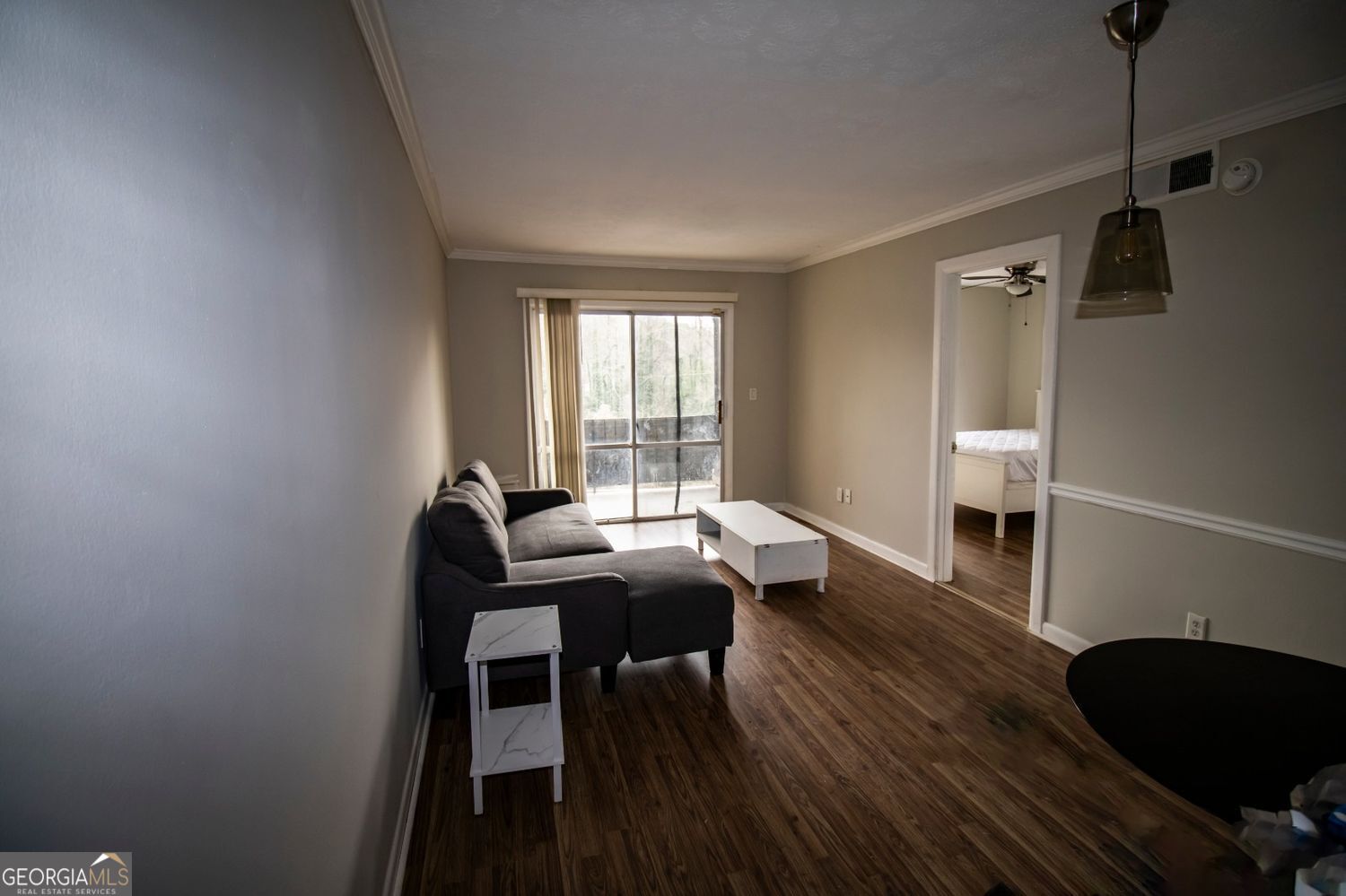 2805 Northeast Expressway Northeast, Unit C11 Atlanta, GA 30329 - Photo 7 of 14 a work room with furniture and wooden floor