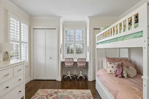 a bedroom with furniture and a window