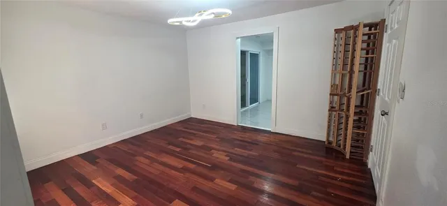 a kitchen with a sink a refrigerator and a stove top oven
