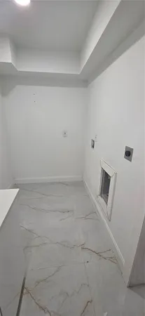 a kitchen with stainless steel appliances refrigerator and microwave