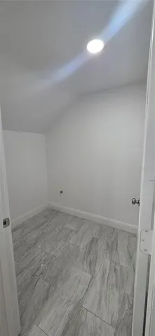 a bathroom with a bathtub and toilet