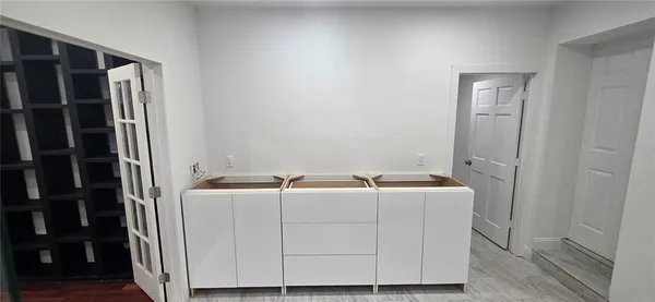 a bathroom with a sink a toilet and mirror