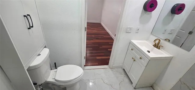 a view of outdoor space and porch with wooden floor