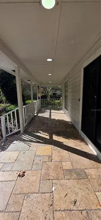 a view of a room with wooden floor and staircase