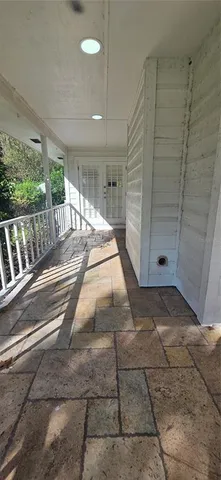 a view of room with wooden floor