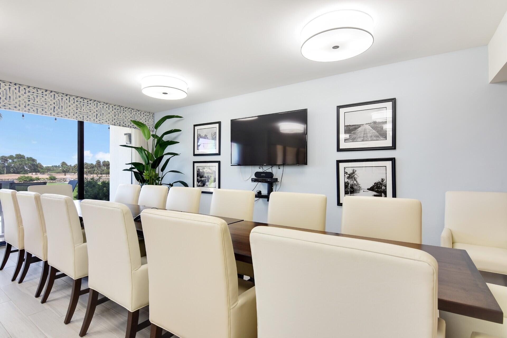 356 Golfview Road, Unit 609 North Palm Beach, FL 33408 - Photo 69 of 104 a living room with furniture and a flat screen tv