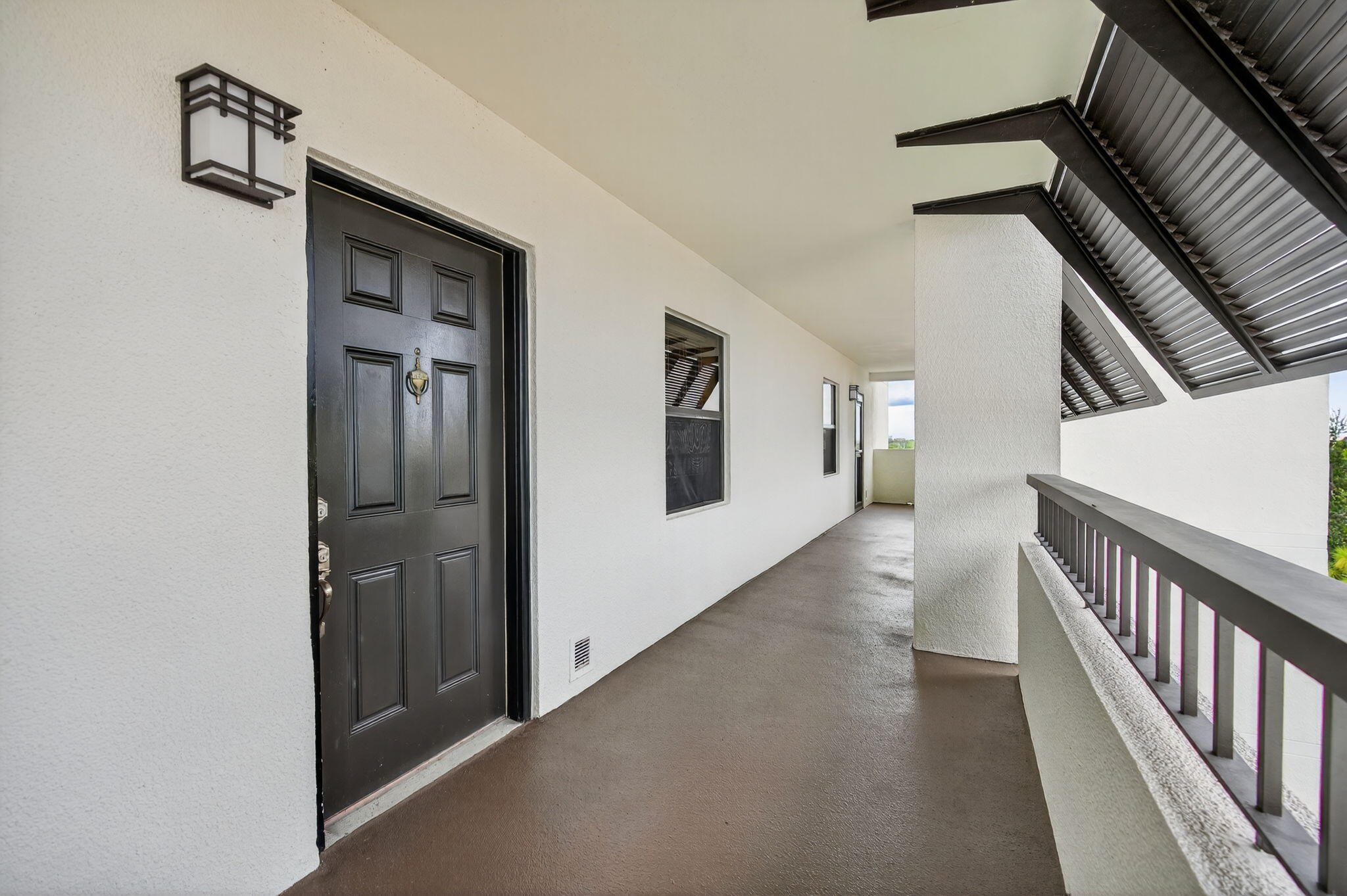 356 Golfview Road, Unit 609 North Palm Beach, FL 33408 - Photo 8 of 104 a view of a hallway with wooden floor and staircase