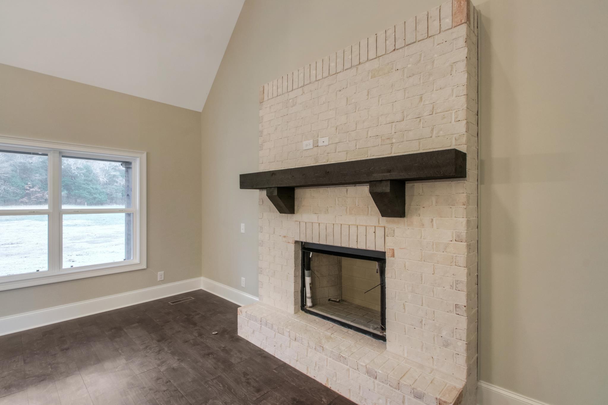 2261 Cairo Bend Road Lebanon, TN 37087 - Photo 14 of 30 a living room with a fireplace