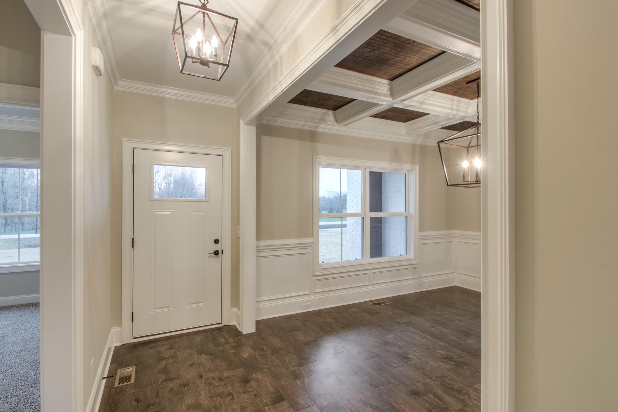 2261 Cairo Bend Road Lebanon, TN 37087 - Photo 3 of 30 an empty room with wooden floor and windows