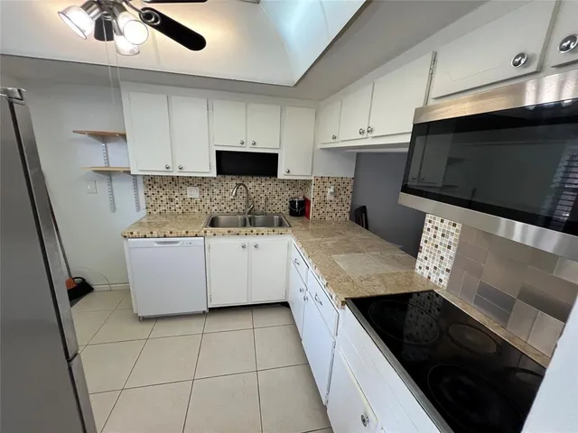 a view of empty room with windows