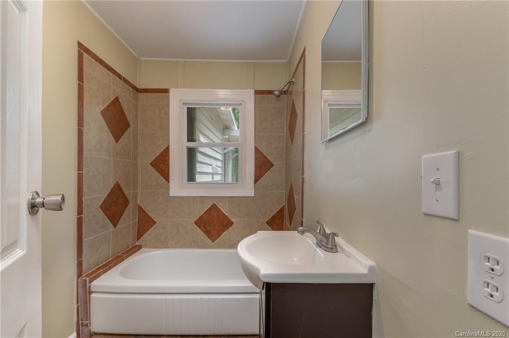 360 East 2nd Street Rutherfordton, NC 28139 - Photo 15 of 19 a bathroom with a sink and a mirror