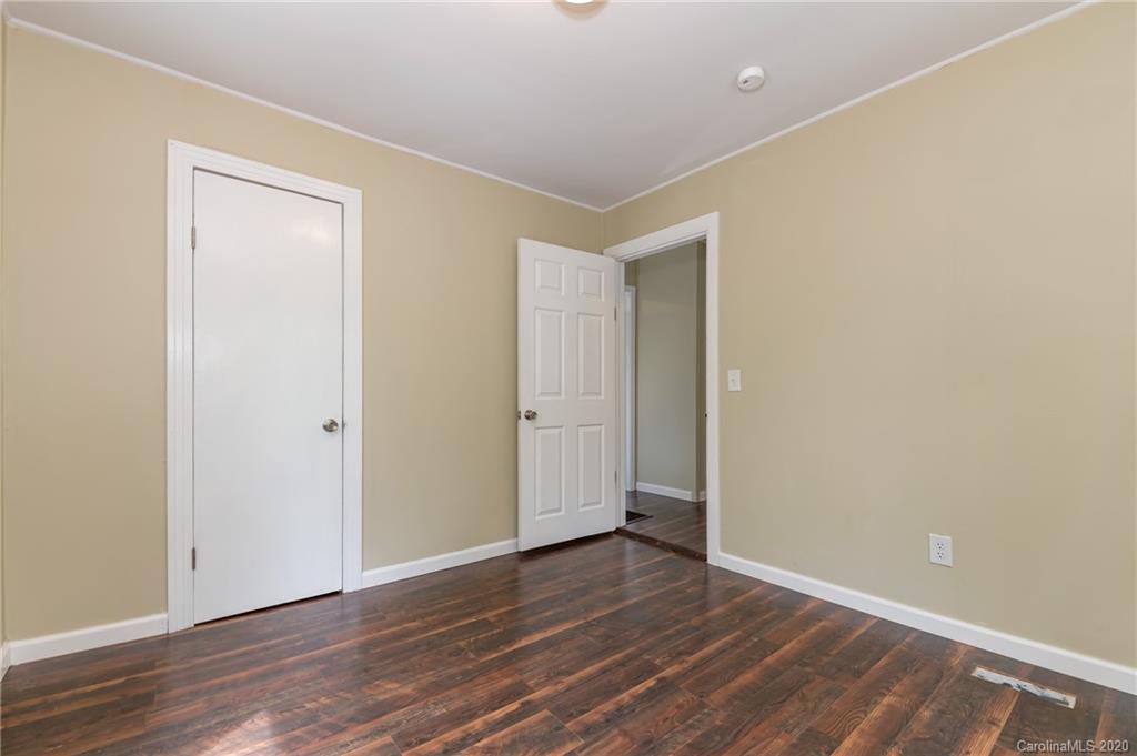 360 East 2nd Street Rutherfordton, NC 28139 - Photo 17 of 19 a view of an empty room with wooden floor
