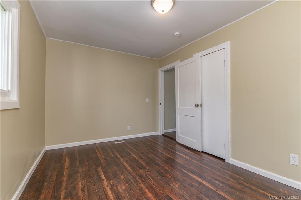 360 East 2nd Street Rutherfordton, NC 28139 - Photo 19 of 19 a view of an empty room with wooden floor