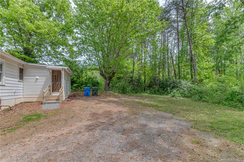 360 East 2nd Street Rutherfordton, NC 28139 - Photo 4 of 19 a view of a yard with large trees