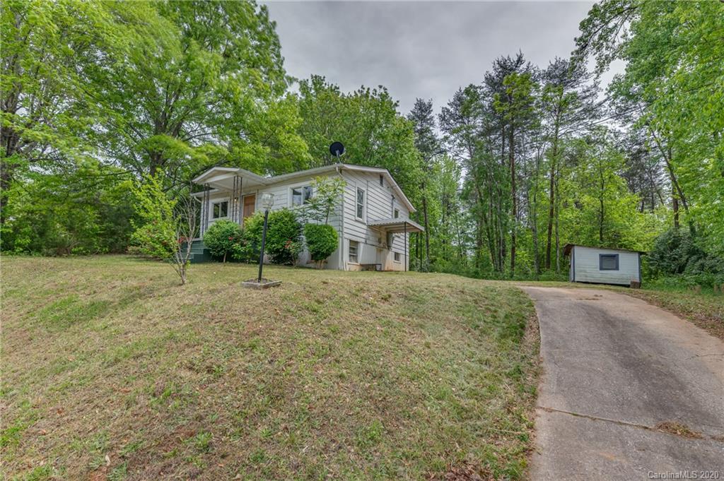 360 East 2nd Street Rutherfordton, NC 28139 - Photo 7 of 19 a view of a house with a yard and large trees