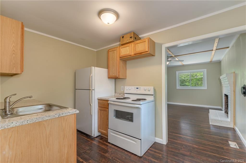360 East 2nd Street Rutherfordton, NC 28139 - Photo 10 of 19 a kitchen with a stove a refrigerator and a sink