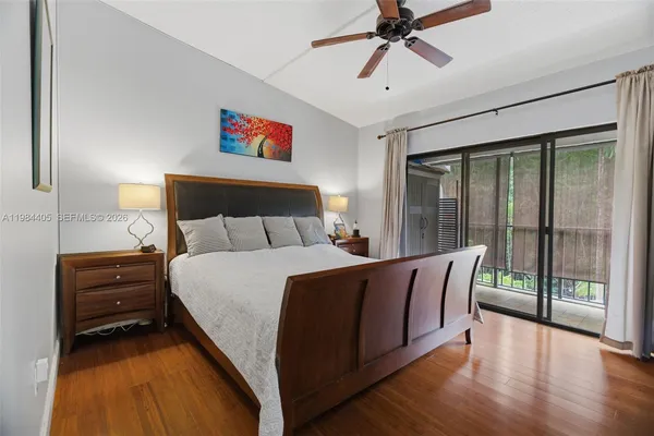 a bed room with a bed and a chandelier