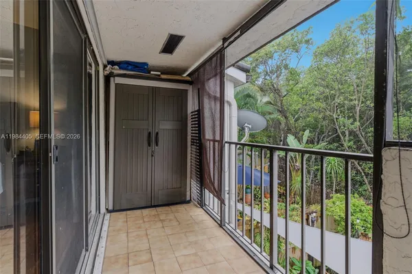 a view of balcony with wooden floor