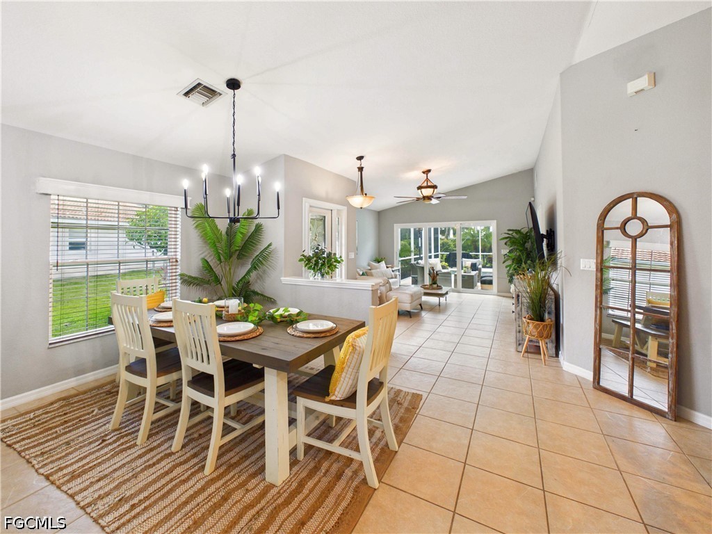 19694 Villa Rosa Loop Estero, FL 33967 - Photo 6 of 28 a view of a dining room with furniture window and wooden floor