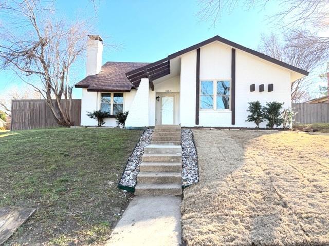 1024 East Peters Colony Road Carrollton, TX 75007 - Photo 3 of 38 Mid-century modern home featuring a chimney and brick siding