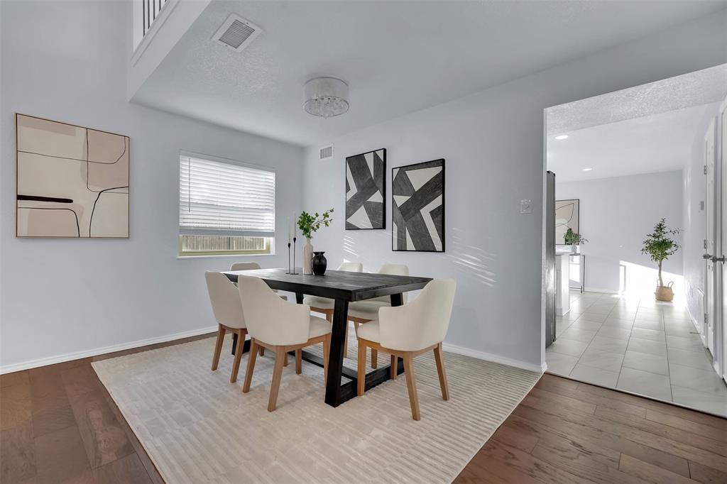1024 East Peters Colony Road Carrollton, TX 75007 - Photo 10 of 38 Dining room featuring hardwood / wood-style flooring and baseboards