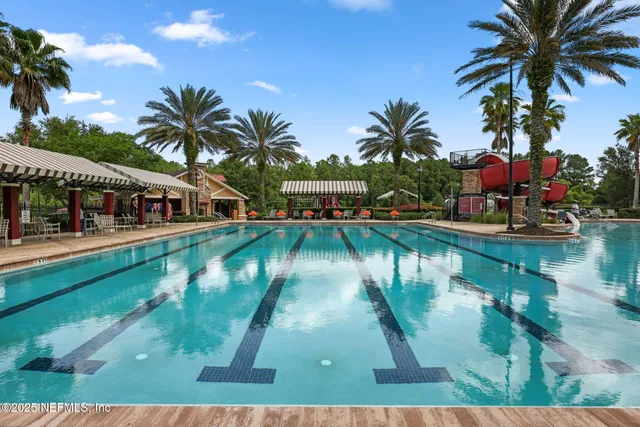 a swimming pool view with a lake view