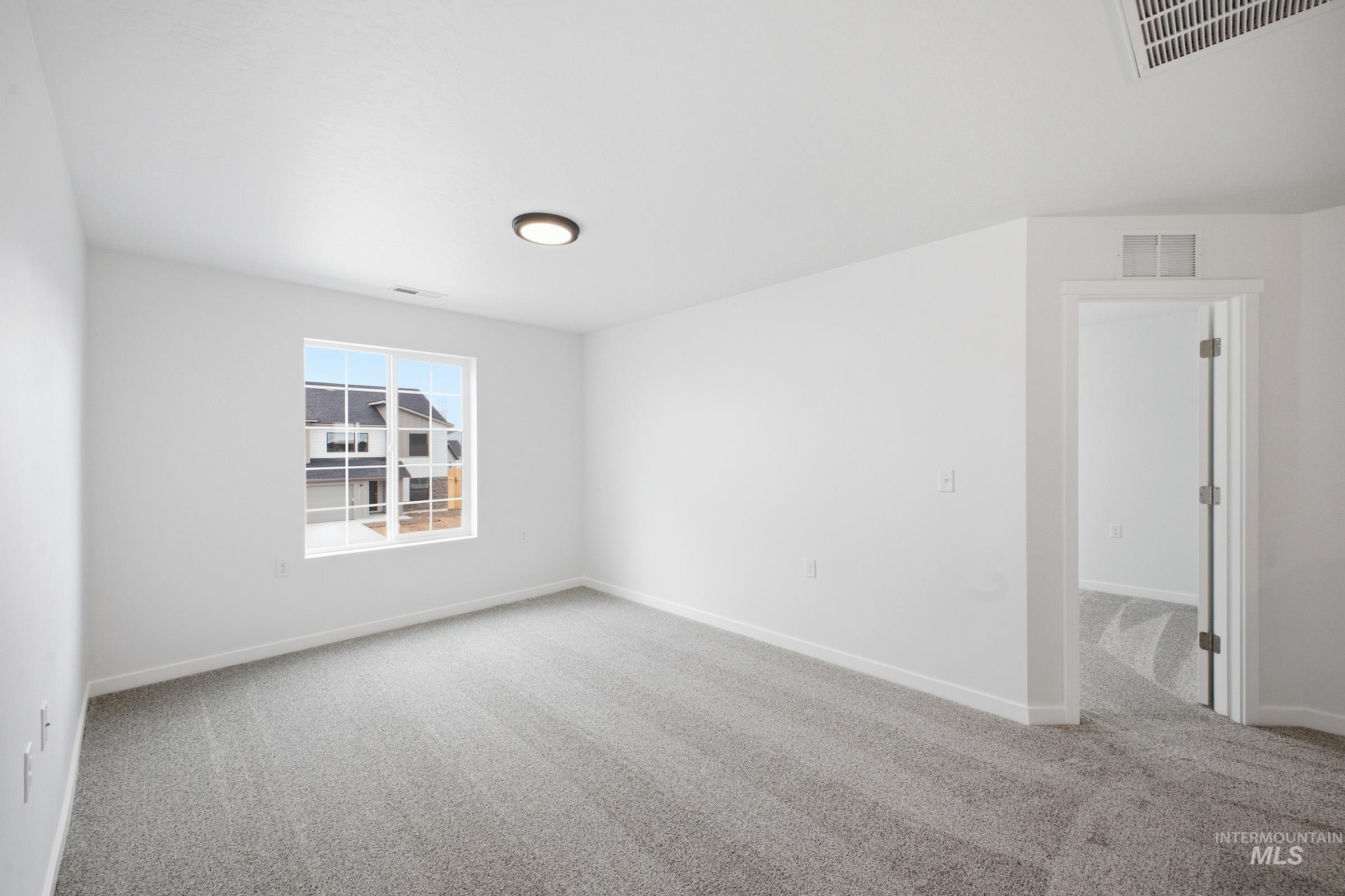 13724 Judson Street Caldwell, ID 83607 - Photo 13 of 23 Spare room with baseboards and light carpet