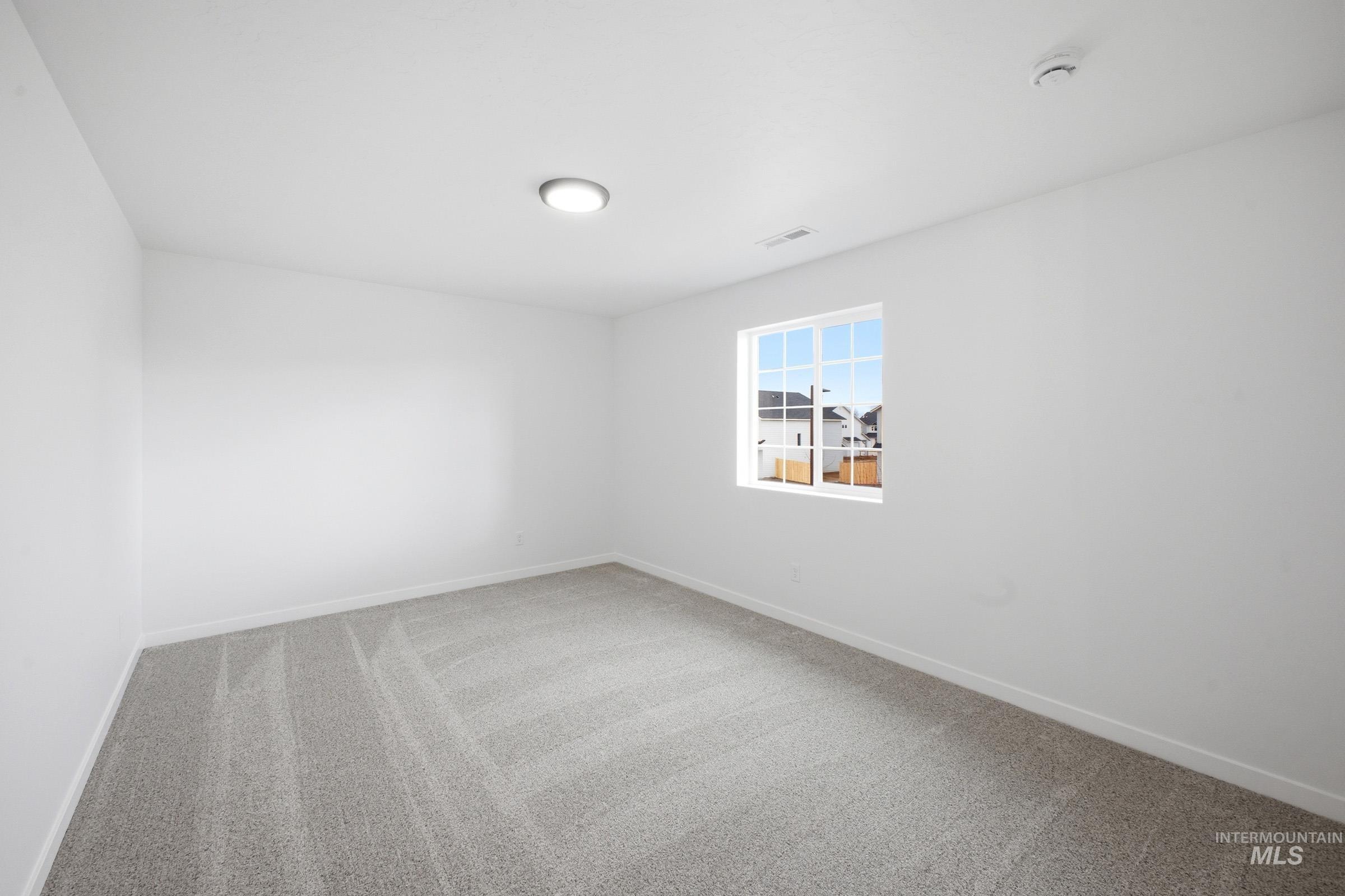 13724 Judson Street Caldwell, ID 83607 - Photo 14 of 23 Unfurnished room with light carpet and baseboards
