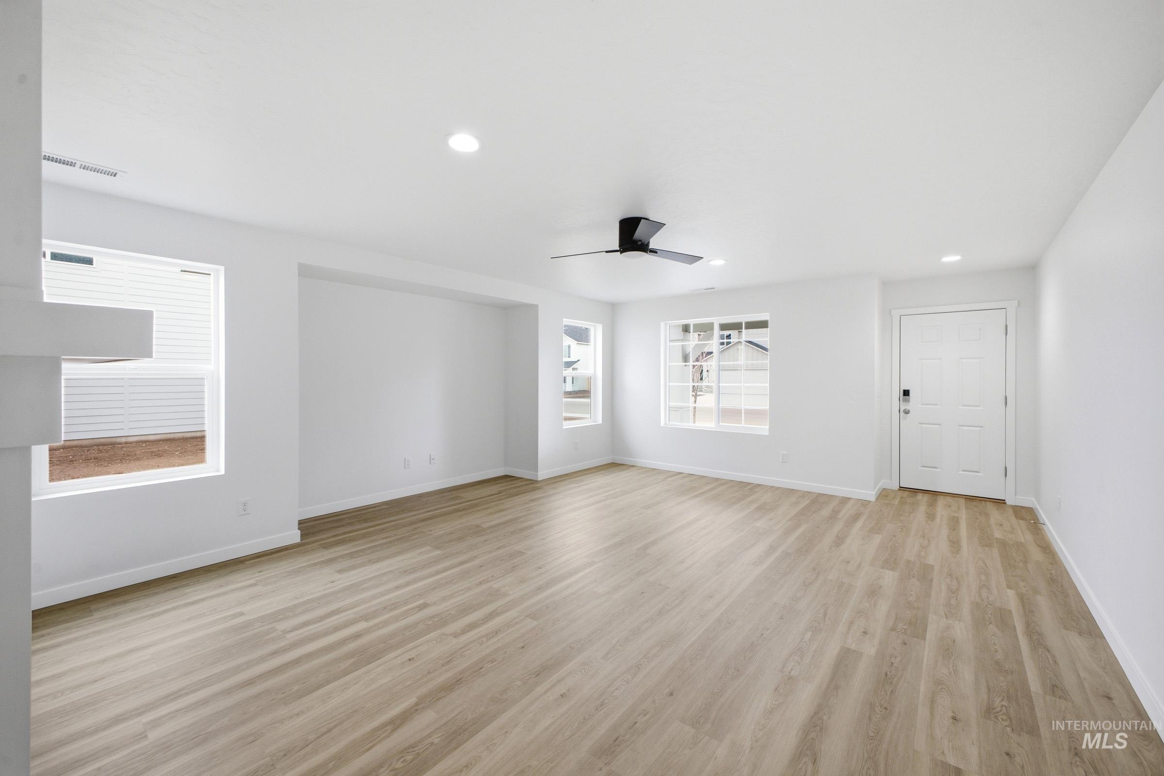 13724 Judson Street Caldwell, ID 83607 - Photo 2 of 23 Unfurnished room featuring light wood-style floors, recessed lighting, and a ceiling fan