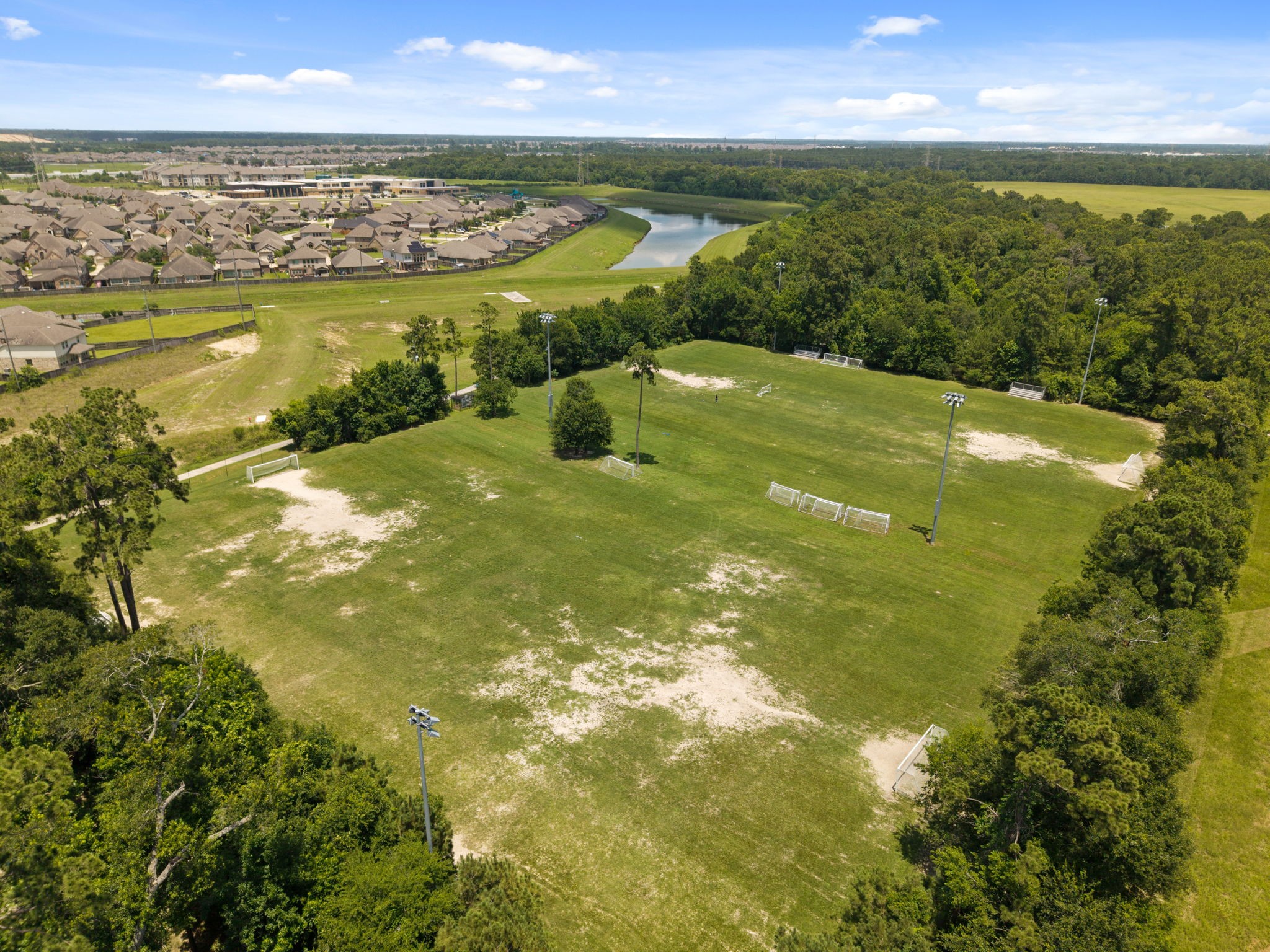 14718 Ramblebrook Humble, TX 77396 - Photo 35 of 38 Soccer fields and wide green areas provide room for recreation, sports, and everyday outdoor use.