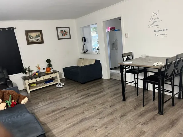 a livingroom with furniture and wooden floor