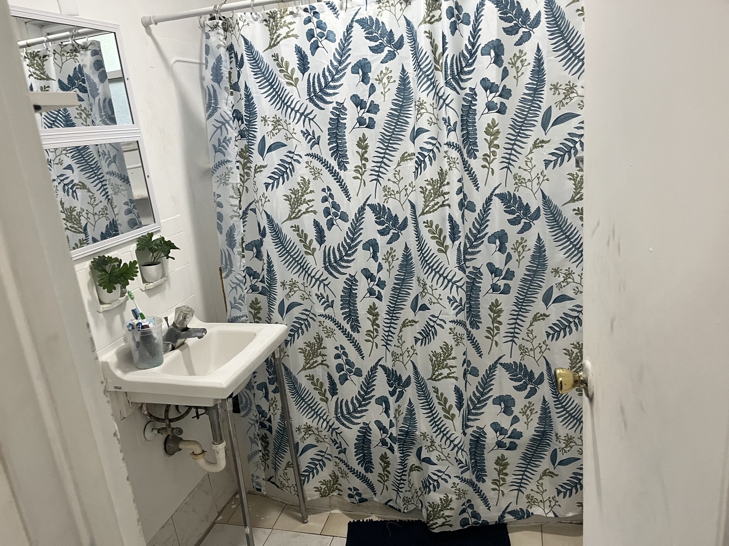 335 Manitowac Street Park Forest, IL 60466 - Photo 6 of 10 a bathroom with a sink and mirror with toilet