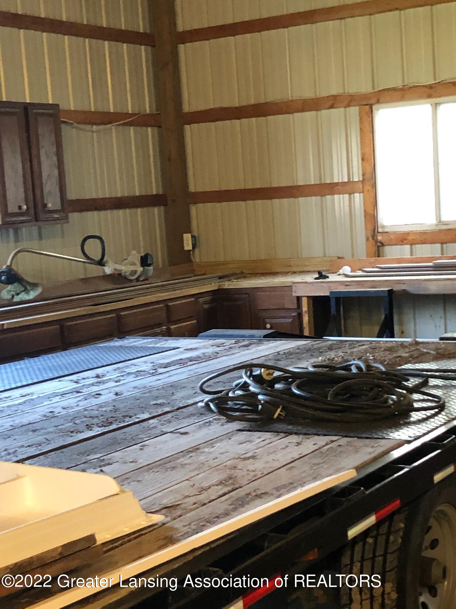 9690 Beardslee Road Perry, MI 48872 - Photo 26 of 31 Workbenches in pole barn