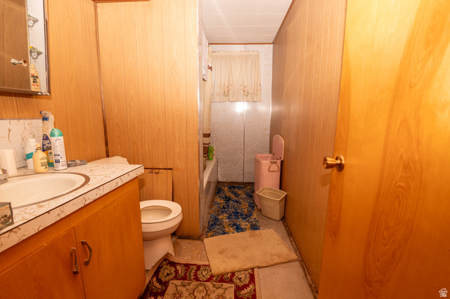 160 North 100 W Street Beaver, UT 84713 - Photo 28 of 36 Full bath with wood walls, vanity, and shower / bath combination