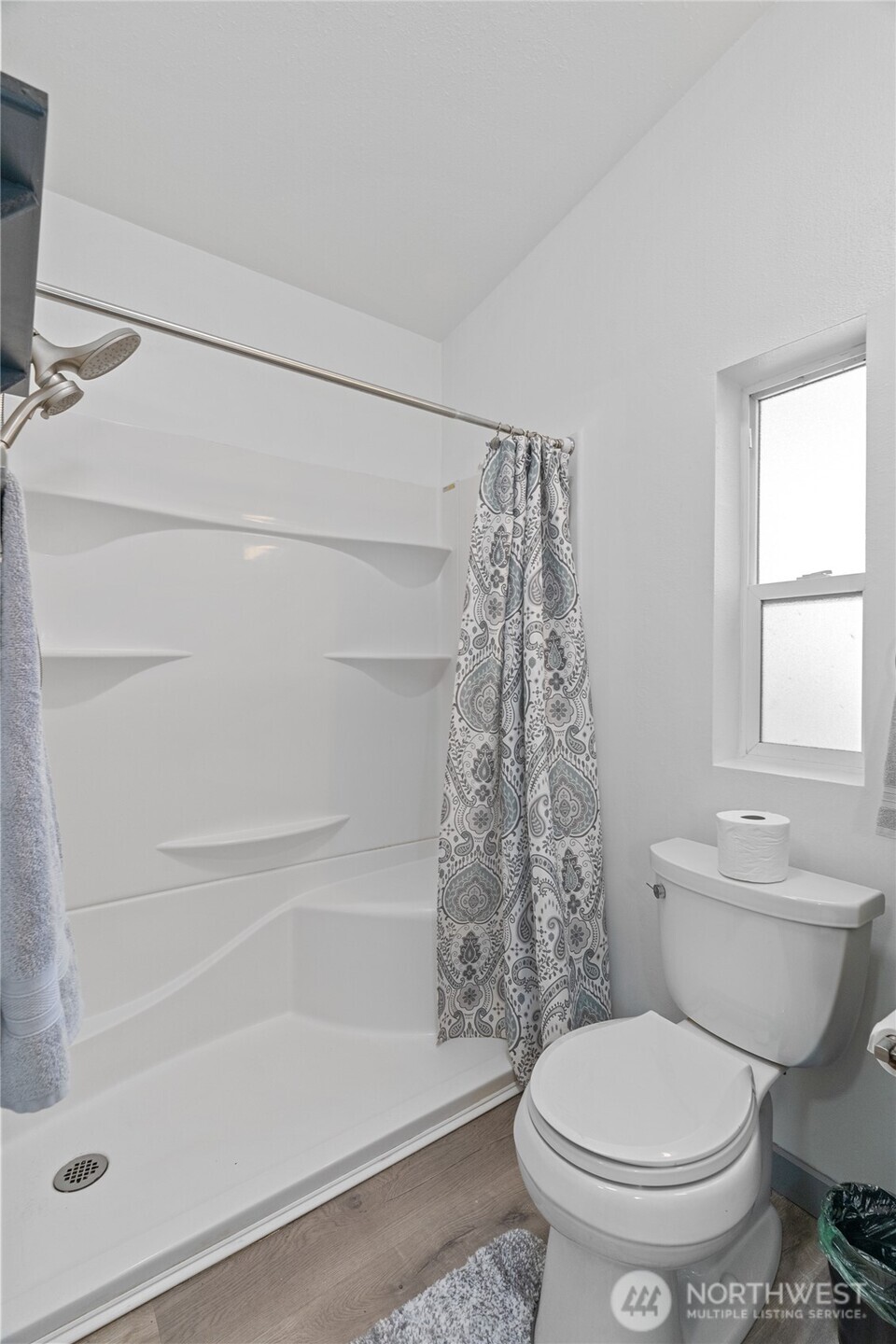 48 Robin Lane Pacific Beach, WA 98571 - Photo 19 of 36 a white toilet sitting next to a bath tub