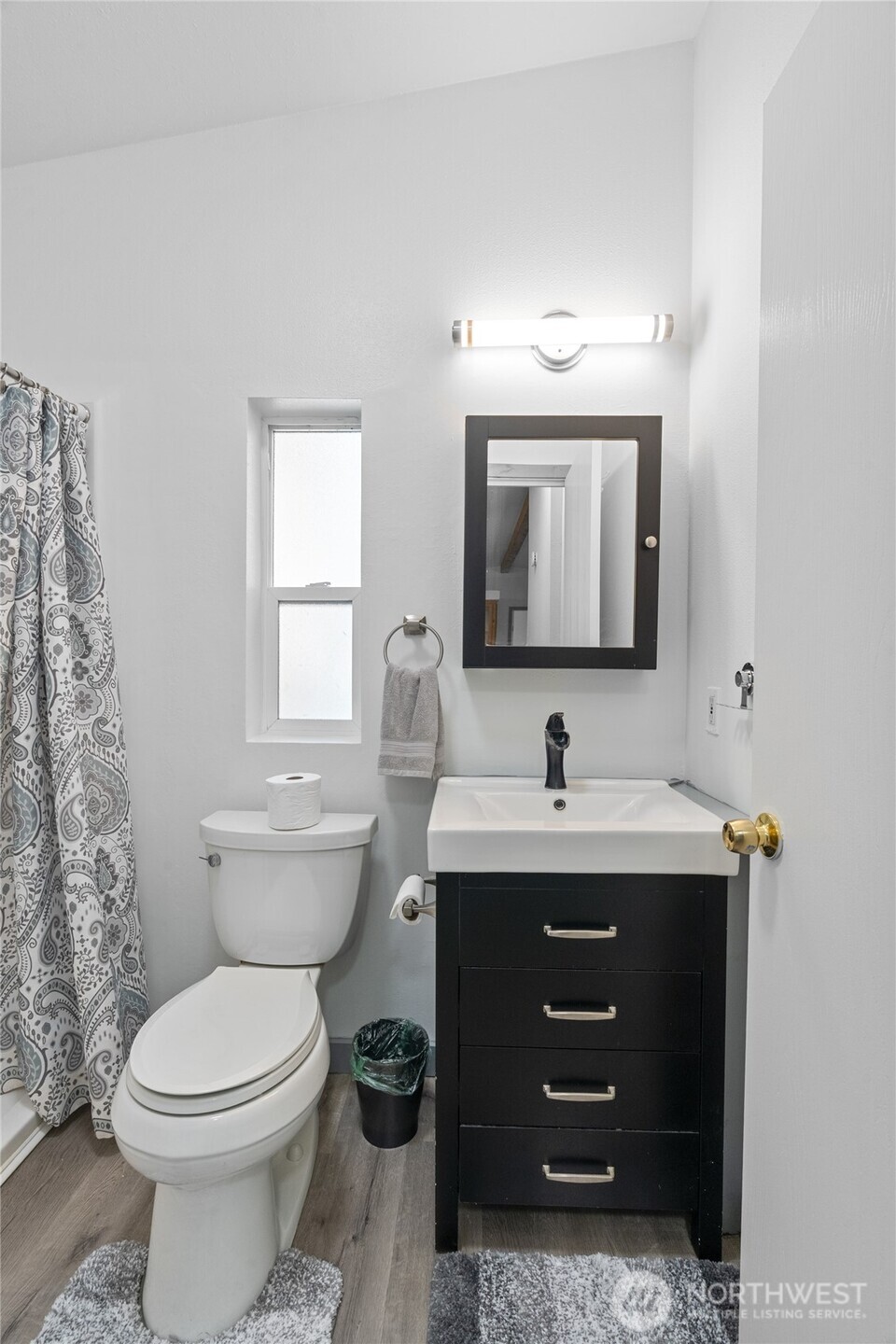 48 Robin Lane Pacific Beach, WA 98571 - Photo 20 of 36 a bathroom with a toilet a sink and mirror