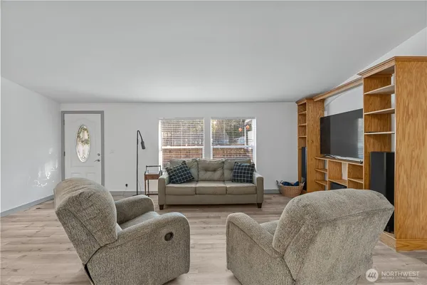 a living room with furniture and a window