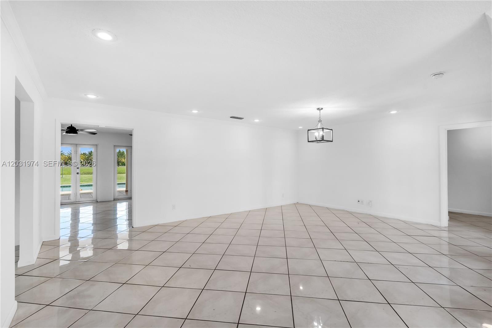 9380 Southwest 134th Street Miami, FL 33176 - Photo 7 of 36 view of family room, the kitchen is off to the left