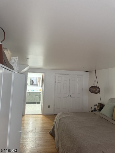 350 Scotland Road, Unit 105 Orange, NJ 07050 - Photo 13 of 17 a bedroom with a bed and a window