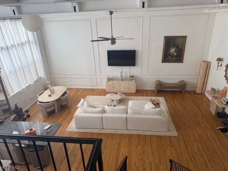350 Scotland Road, Unit 105 Orange, NJ 07050 - Photo 6 of 17 a living room with furniture and a flat screen tv
