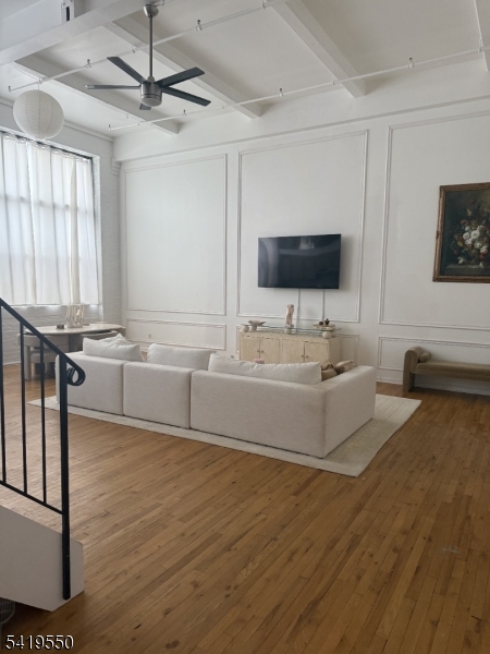 350 Scotland Road, Unit 105 Orange, NJ 07050 - Photo 7 of 17 a living room with furniture and a flat screen tv